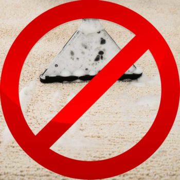 NO sign over a wet-vac cleaner on dirty carpet